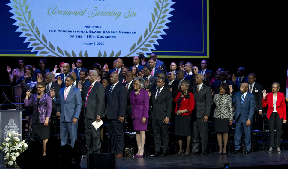 Members of the Congressional Black Caucus are sworn in as the 116th Members of the Congress at The Warner Theatre in Washington, Thursday, Jan. 3, 2019. (AP Photo/Jose Luis Magana)