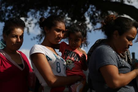 Undocumented immigrant families are released from detention at a bus depot in McAllen, Texas, U.S., June 22, 2018. REUTERS/Loren Elliott