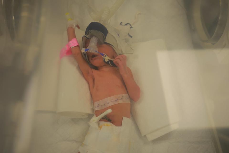 Sabreen Roh, a baby delivered 10 weeks premature after her mother was killed by an airstrike in Gaza, is pictured in an incubator at Emirata Hospital in Rafah on April 24, 2024.