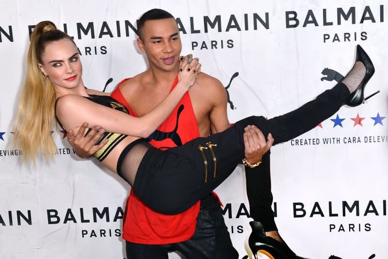 Cara Delevingne (L) and Olivier Rousteing attend the Puma x Balmain x Cara Delevingne launch party in 2019. File Photo by Chris Chew/UPI