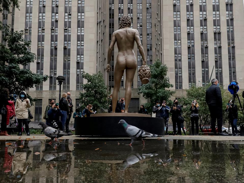 People gather for the public unveil of the newest work by artist Luciano Garbati, 'Medusa With The Head of Perseus', at Collect Pond Park in the Manhattan borough of New York City, U.S., October 13, 2020.