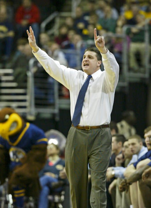Kent State coach Jim Christian signals to his players during the finals of the Mid-American Conference basketball tournament against Akron Saturday, March 15, 2008, in Cleveland. (AP Photo/Ron Schwane)
