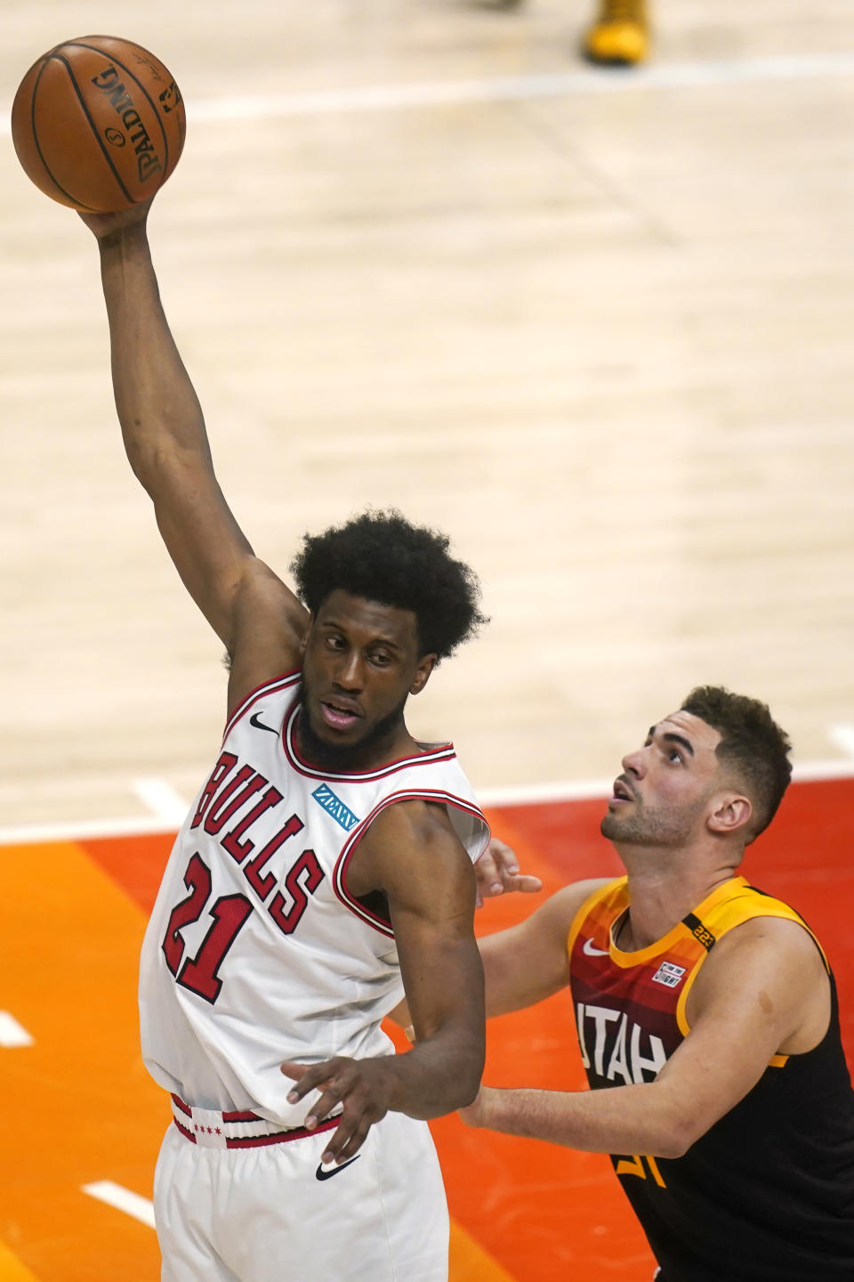 Utah Jazz forward Georges Niang, right, guards Chicago Bulls forward Thaddeus Young (21) in the second half during an NBA basketball game Friday, April 2, 2021, in Salt Lake City. (AP Photo/Rick Bowmer)