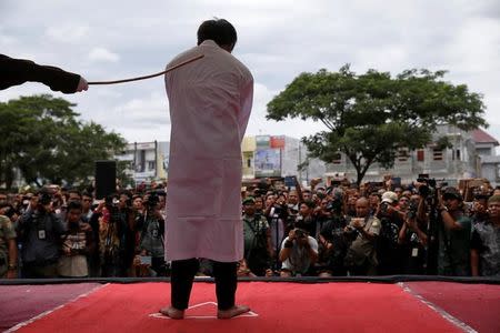 An Indonesian man is publicly caned for having gay sex, in Banda Aceh, Aceh province, Indonesia May 23, 2017. REUTERS/Beawiharta TPX IMAGES OF THE DAY