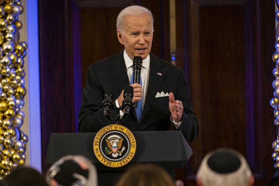 US President Joe Biden speaks during a Hanukkah Holiday Reception in the Grand Foyer of the White House