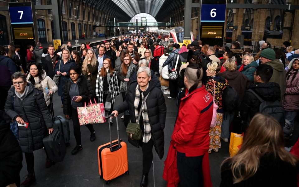 ) Commuters at a train station in London, Britain, 05 December 2022 - ANDY RAIN/EPA-EFE/Shutterstock/Shutterstock