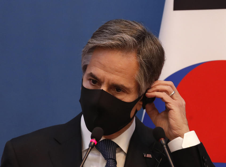 U.S. Secretary of State Antony Blinken adjusts his earphone during the joint press conference after their meeting with U.S. Defense Secretary Lloyd Austin, South Korean Foreign Minister Chung Eui-yong, and South Korean Defense Minister Suh Wook at the Foreign Ministry in Seoul, South Korea, Thursday, March 18, 2021. (AP Photo/Lee Jin-man, Pool)