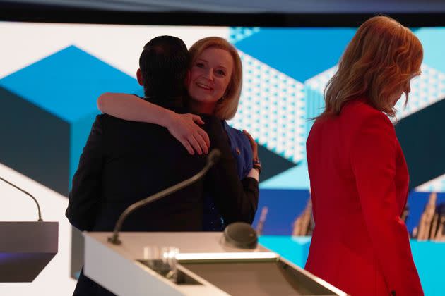 Rishi Sunak and Liz Truss hug each other after taking part in the BBC Leadership debate presented by Sophie Raworth. (Photo: WPA Pool via Getty Images)