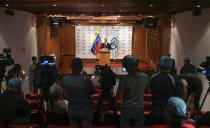 Venezuela's Attorney General Tarek William Saab gives a press conference regarding what the government calls a failed attack over the weekend aimed at overthrowing President Nicolás Maduro in Caracas, Venezuela, Monday, May 4, 2020. The government’s claims that it had foiled a beach landing Sunday triggered a frenzy of confusing claims and counterclaims about the alleged plot. (AP Photo/Matias Delacroix)