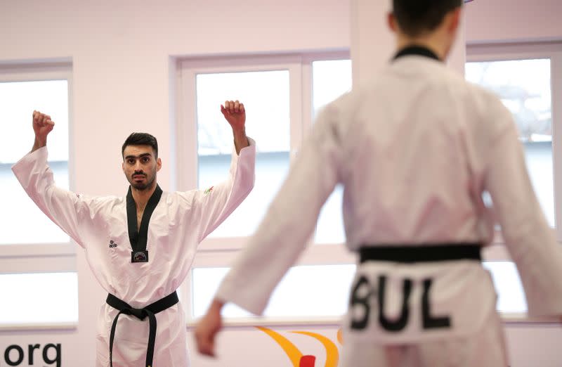 Iranian taekwondo competitor Zolghadri warms up during a training session in Sofia