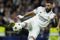Real Madrid's Karim Benzema kicks the ball during the Champions League Group F soccer match between Real Madrid and Celtic at the Santiago Bernabeu stadium in Madrid, Spain, Wednesday, Nov. 2, 2022. (AP Photo/Manu Fernandez)