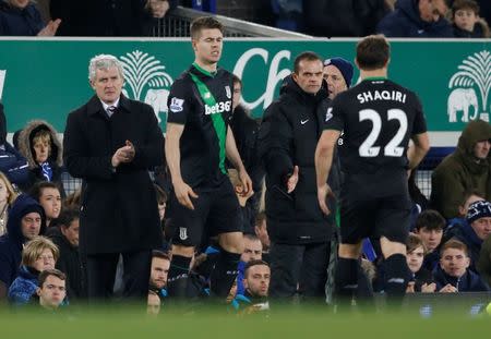 Football Soccer - Everton v Stoke City - Barclays Premier League - Goodison Park - 28/12/15 Stoke's Xherdan Shaqiri is substituted for Marco van Ginkel as manager Mark Hughes looks on Action Images via Reuters / Carl Recine Livepic