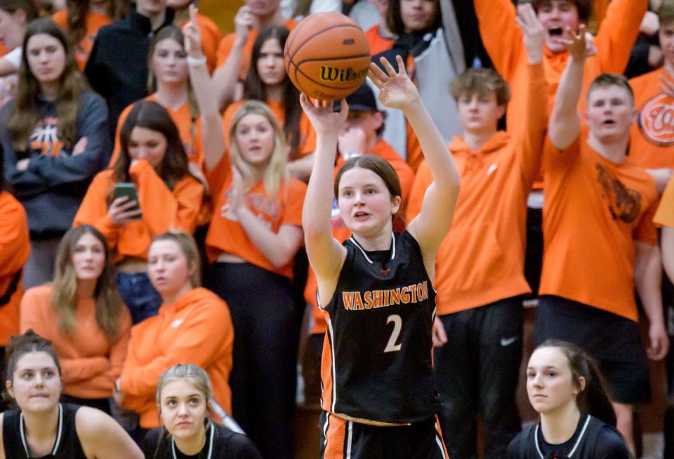 Teammates and players watch as Washington's Avery Tibbs puts up a three pointer against the Geneseo Maple Leafs in the second half of the Class 3A Girls Basketball Richwoods Sectional semifinals Tuesday, Feb. 21, 2023 at Richwoods High School.