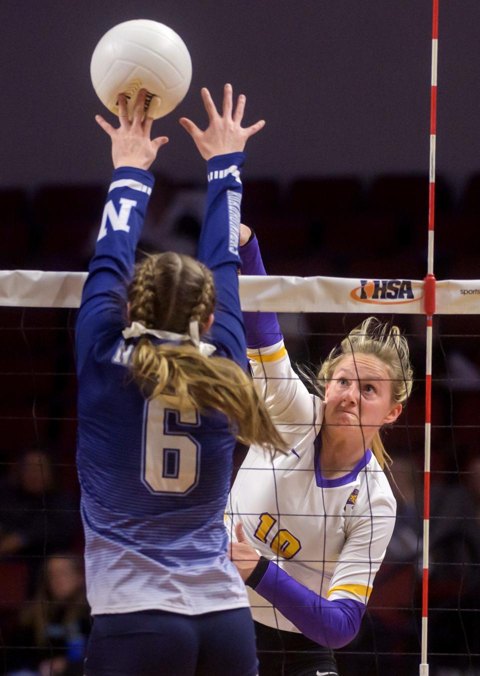 Nazareth Academy's Kitty Sandt (6) gets her fingertips on Taylorville's Elle Richards' attempted kill during their Class 3A volleyball state semifinal Nov. 11 at CEFCU Arena in Normal.