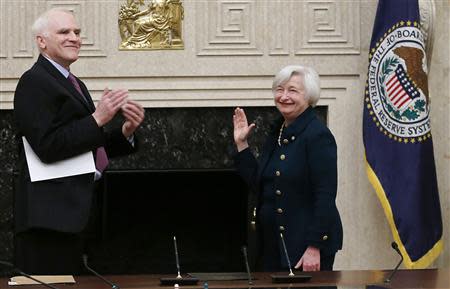 Federal Reserve Board Governor Daniel Tarullo (L) applauds new Federal Reserve Board Chairwoman Janet Yellen after administering the oath of office to Yellen at the Federal Reserve Board in Washington February 3, 2014. REUTERS/Jim Bourg