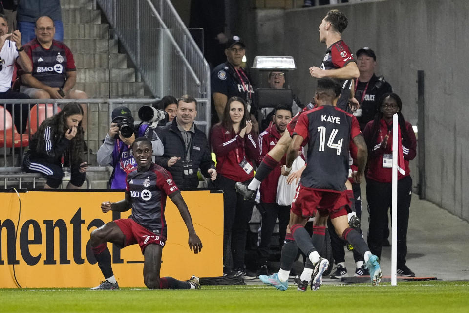 Toronto FC midfielder Richie Laryea, left, celebrates his goal against Atlanta United during the first half of an MLS soccer match Saturday, April 15, 2023, in Toronto. (Andrew Lahodynskyj/The Canadian Press via AP)