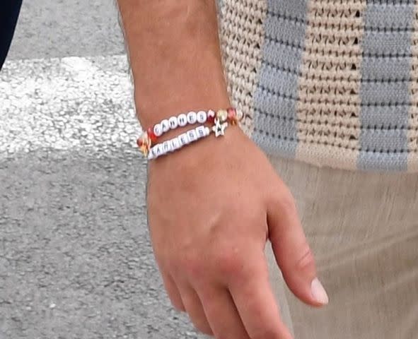<p>Newspress / BACKGRID</p> Travis Kelce wearing friendship bracelets in Cannes.
