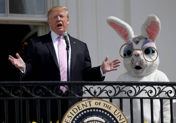 Former President Donald Trump, accompanied by a person dressed as the Easter Bunny, welcomes guests with opening remarks during the 141st Easter Egg Roll on the South Lawn of the White House April 22, 2019 in Washington, DC. 