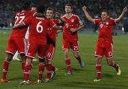 Thiago (6) of Germany's Bayern Munich celebrates his goal against Morocco's Raja Casablanca with his team-mates during their 2013 FIFA Club World Cup final match at Marrakech stadium December 21, 2013. REUTERS/Youssef Boudlal