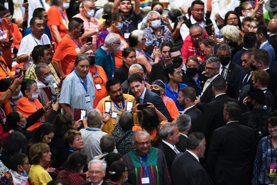 Canadian Prime Minister Justin Trudeau, center right, poses for photographs ahead of a mass with Pope Francis at the National Shrine of Saint Anne de Beaupre, Thursday, July 28, 2022, in Saint Anne de Beaupre, Quebec. Pope Francis is on a "penitential" six-day visit to Canada to beg forgiveness from survivors of the country's residential schools, where Catholic missionaries contributed to the "cultural genocide" of generations of Indigenous children by trying to stamp out their languages, cultures and traditions. (AP Photo/John Locher)