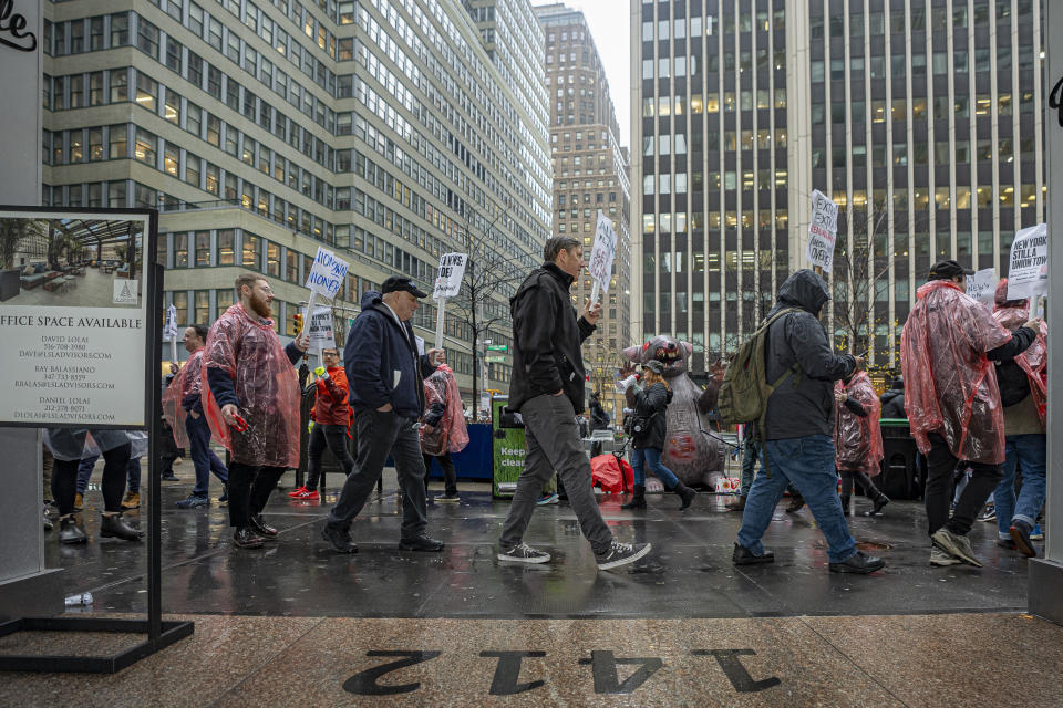 Daily News employees picket outside the newspaper's headquarters at 1412 Broadway, Thursday, Jan. 25, 2024, in New York. (AP Photo/Peter K. Afriyie)