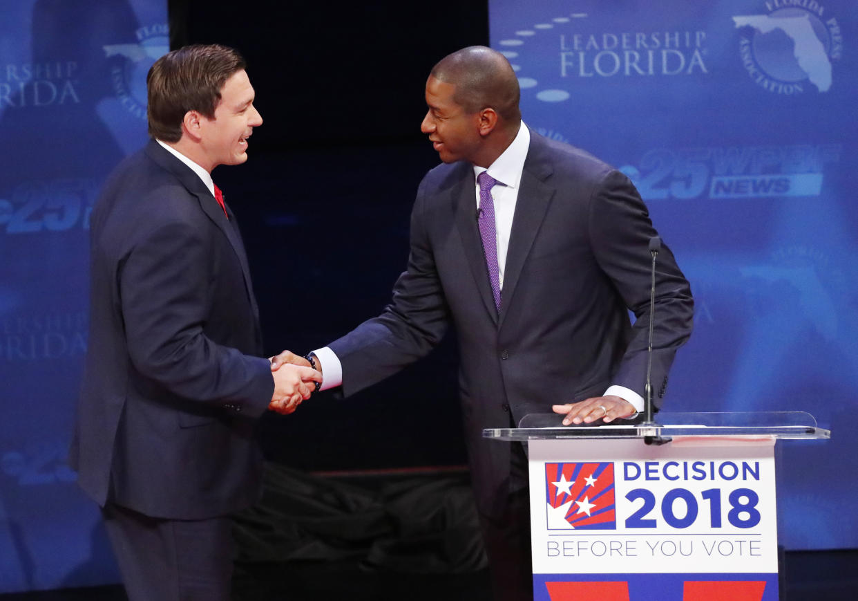 Florida gubernatorial candidates, Republican Ron DeSantis, left, and Democrat Andrew Gillum shake hands before a debate on Wed., Oct. 24, 2018, at Broward College in Davie, Fla. (Photo: Wilfredo Lee/AP)