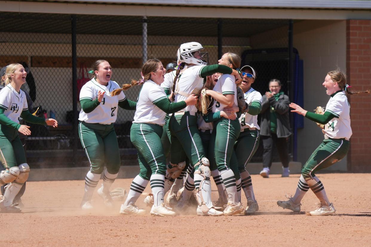 The Pendleton Heights Arabians celebrate their win against the Penn Kingsmen during the Carmel Softball Invitational on Saturday, April 20, 2024, at the Cherry Tree Softball Complex in Carmel, Indiana.