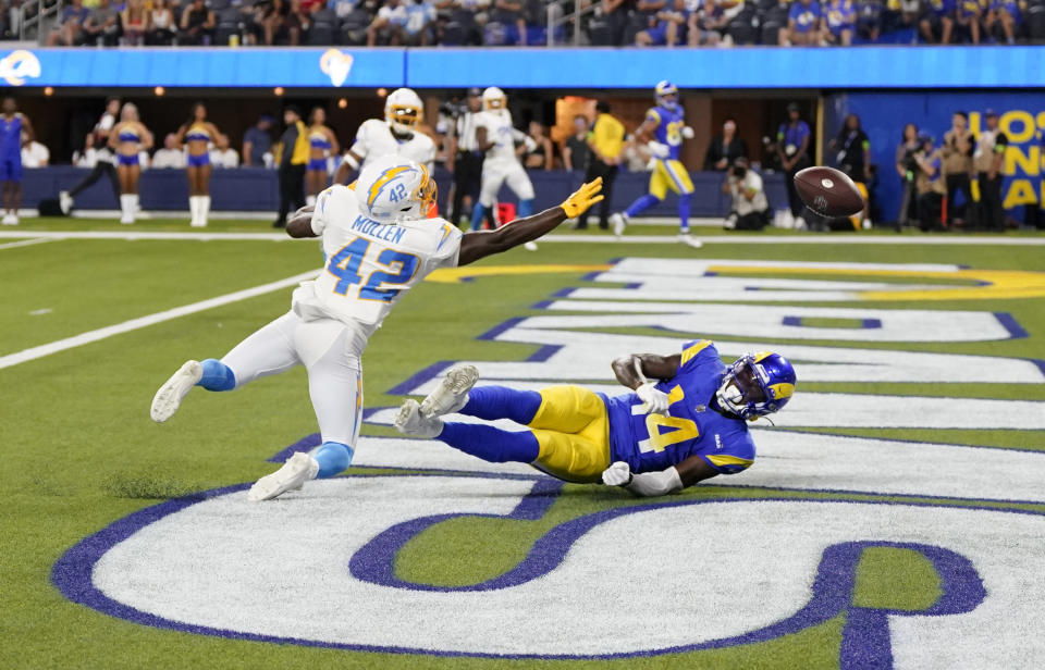 INGLEWOOD, CALIFORNIA – AUGUST 12: Cornerback Tiawan Mullen #42 of the Los Angeles Chargers attempts to break up a pass intended for wide receiver Tyler Johnson #14 of the Los Angeles Rams during the second half of a pre-season NFL game at SoFi Stadium on August 12, 2023 in Inglewood, California. (Photo by Kevork Djansezian/Getty Images)