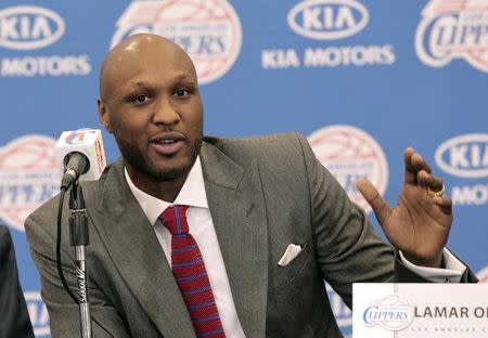 Basketball player Lamar Odom speaks at a news conference announcing his acquisition by the Los Angeles Clippers in Los Angeles, California July 2, 2012. REUTERS/Mario Anzuoni
