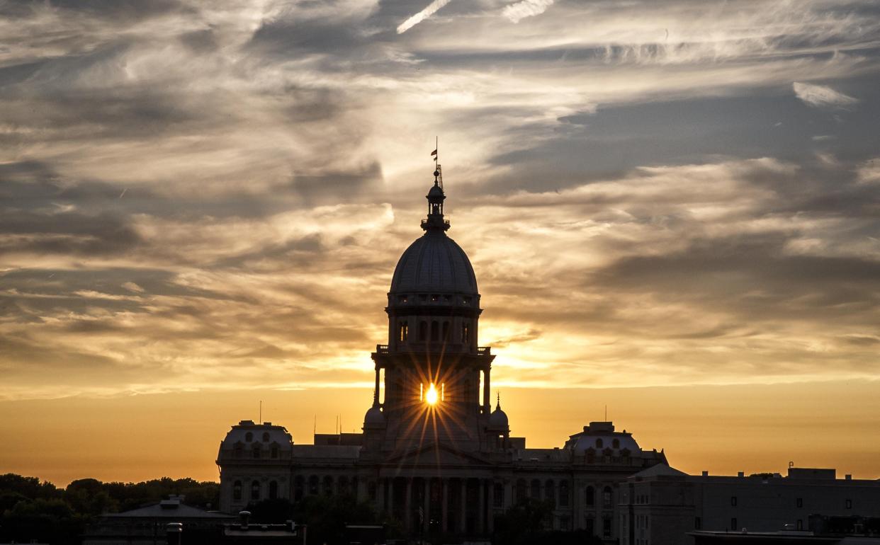The dome of the Illinois Capitol in Springfield is seen in this 2017 file photo taken at sunset.