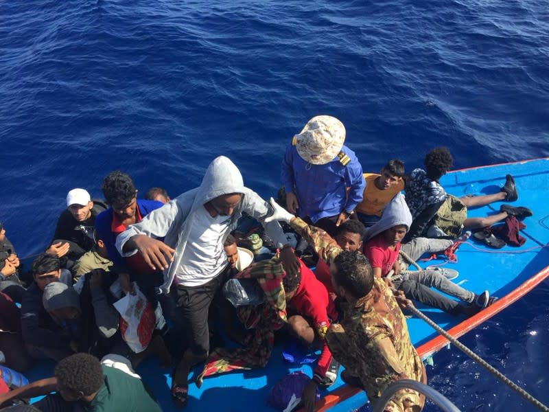 Migrants are seen in a dinghy as they are rescued by Libyan coast guards at the Mediterranean Sea off the coast of Libya