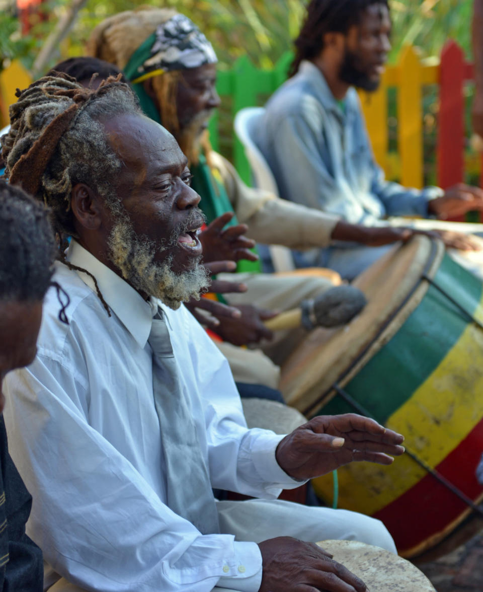 A Rastafarian drummer leads a chant during the celebration of reggae music icon Bob Marley's 68th birthday in the yard of his Kingston home, in Jamaica, Wednesday, Feb. 6, 2013. Marley's relatives and old friends were joined by hundreds of tourists to dance and chant to the pounding of drums to honor the late reggae icon who died of cancer in 1981 at age 36. (AP Photo/David McFadden)