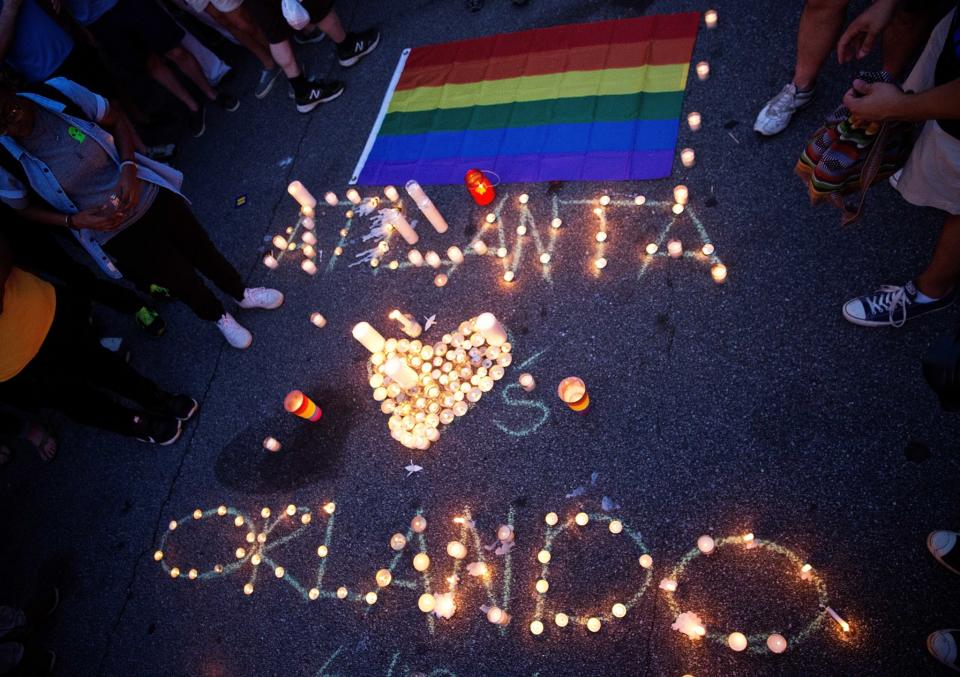 <p>A message spelled out in candles is laid out at a vigil in Atlanta. (AP/David Goldman) </p>