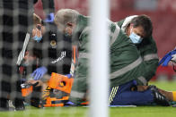 Wolverhampton Wanderers' Raul Jimenez receive treatment from medical staff after a head clash with Arsenal's David Luiz during the English Premier League soccer match between Arsenal and Wolverhampton Wanderers at Emirates Stadium, London, Sunday, Nov. 29, 2020. (Catherine Ivill/Pool via AP)