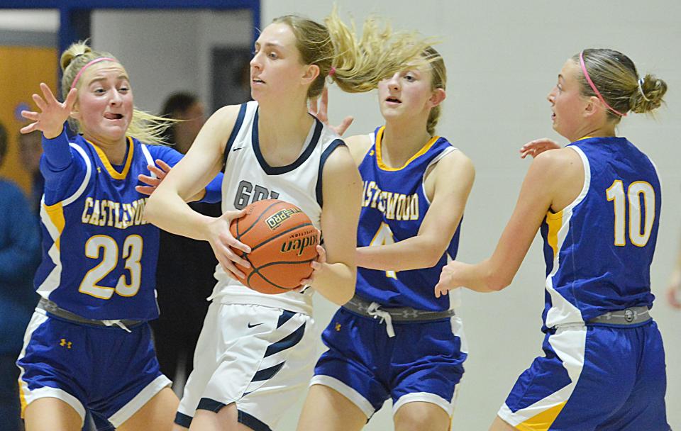 Great Plains Lutheran's Olivia Holmen is surrounded by Castlewood's Cassidy Kirwan (23), Sophia Kudrna (4) and Cydni Kudrna during their high school girls basketball game on Thursday, Jan. 11, 2024 in Watertown. Holmen's field-goal with 14 seconds left lifted GPL to a 43-42 win.
