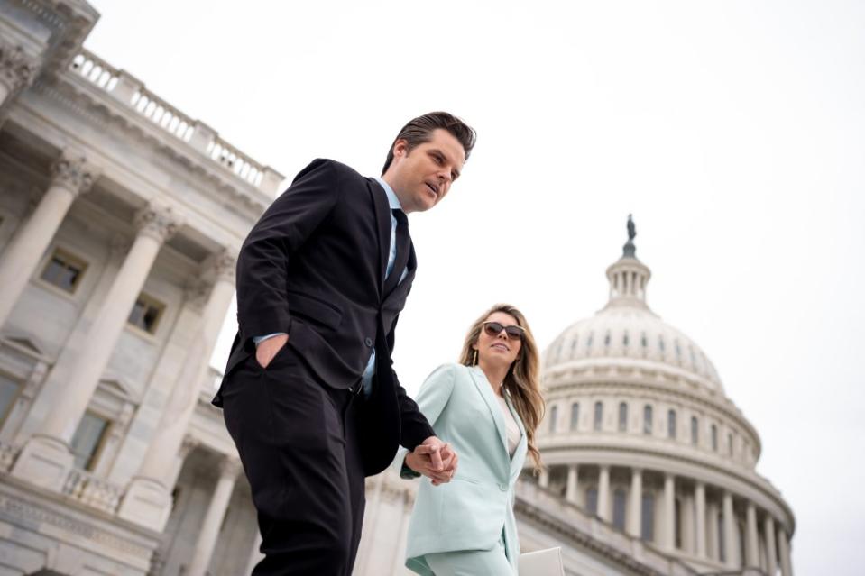 Rep. Matt Gaetz (R-Fla.) and his wife, Ginger Luckey, walk down the steps of the House of Representatives on Capitol Hill following a vote on April 19 in Washington, DC. Getty Images