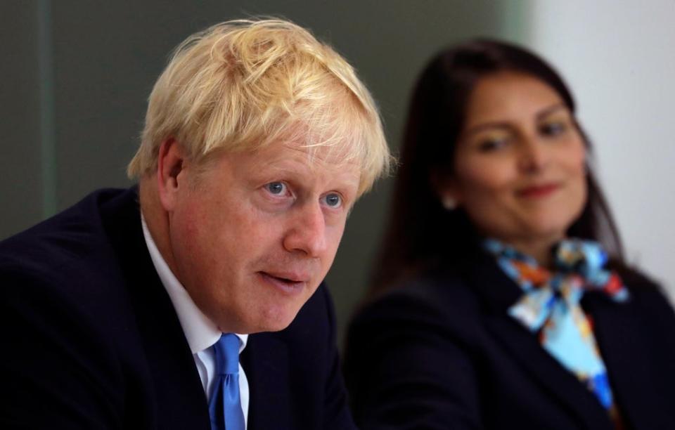 Prime Minister Boris Johnson with Home Secretary Priti Patel (PA) (PA Archive)