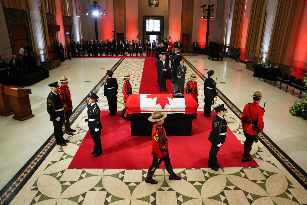 Dignitaries line up to pay their respects to former prime minister Brian Mulroney as he lies in state at the Sir John A. Macdonald building opposite Parliament Hill in Ottawa on Tuesday, March 19, 2024. THE CANADIAN PRESS/Sean Kilpatrick