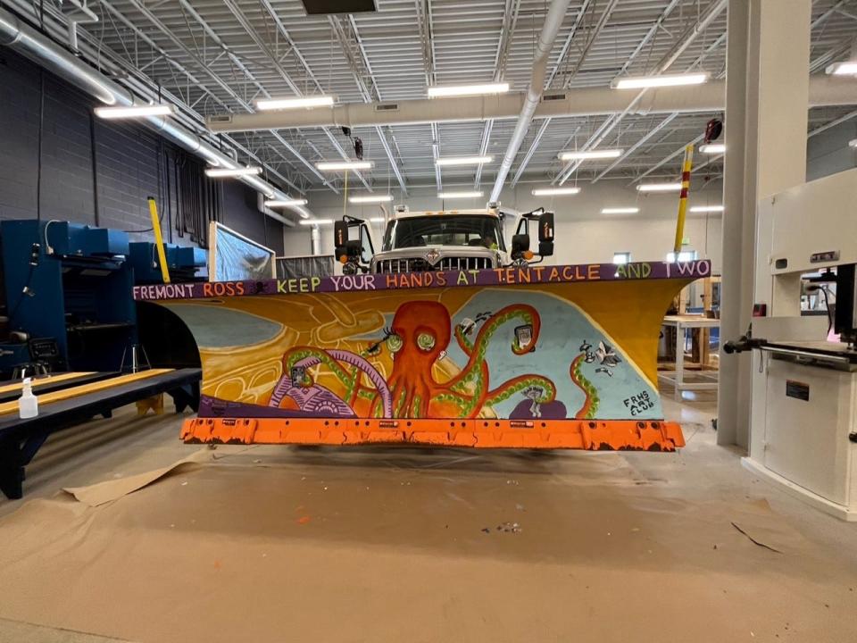 An Ohio Department of Transporation District 2 snowplow sports a plow decorated by Ross High School art students.