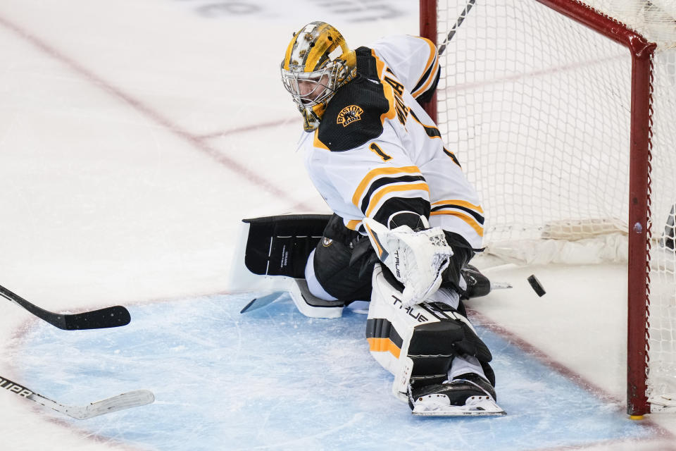 Boston Bruins' Jeremy Swayman (1) stops a shot on goal during the third period of an NHL hockey game against the New York Rangers Thursday, Jan. 19, 2023, in New York. The Bruins won 3-1. (AP Photo/Frank Franklin II)