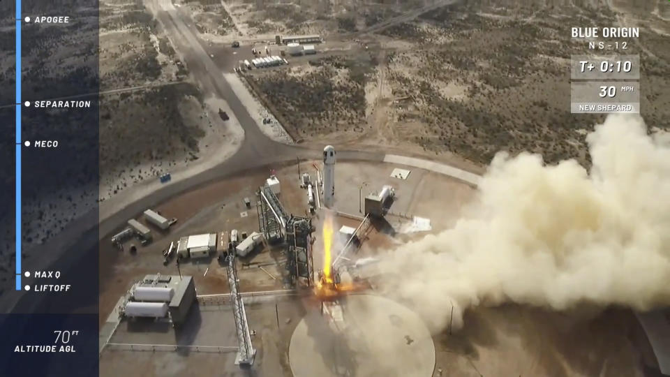 In this image taken from video provided by Blue Origin, the New Shepard rocket takes off near Van Horn, Texas. Blue Origin, Jeff Bezos' space company, has scored another successful spaceflight, when it launched and landed the same rocket for the sixth time Wednesday. (Blue Origin via AP)