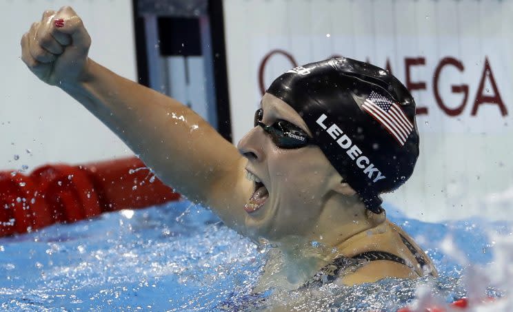 United States' Katie Ledecky celebrates winning the gold medal in the women's 400-meter freestyle setting a new world record during the swimming competitions at the 2016 Summer Olympics, Sunday, Aug. 7, 2016, in Rio de Janeiro, Brazil. (AP Photo/Matt Slocum)