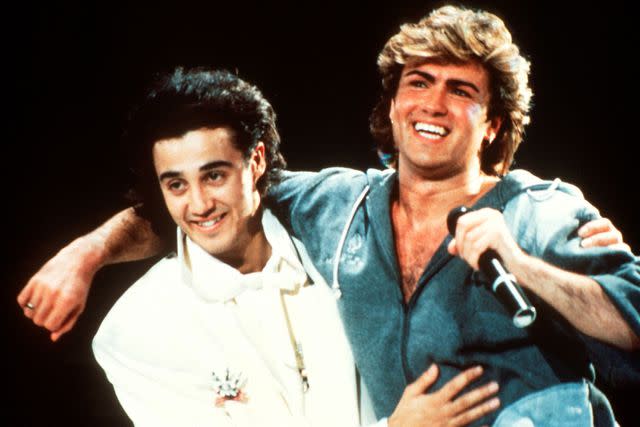 <p>Michael Putland/Getty </p> Wham!'s Andrew Ridgeley and George Michael performing together in 1985.