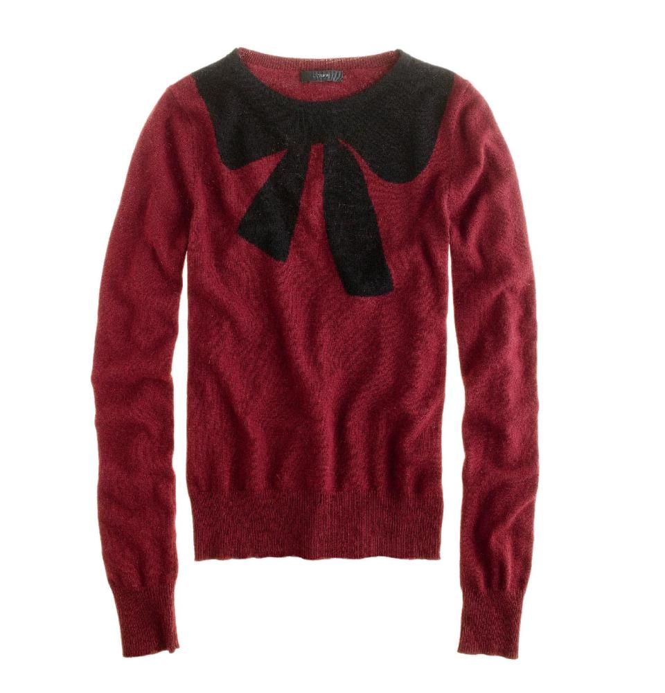 This undated publicity photo provided by J.Crew shows a crewneck sweater decorated with an oversized bow motif at the neckline by J.Crew. The good, the bad, the kitschy. A "seasonal sweater" is one way to start a conversation at a holiday function. (AP Photo/J.Crew)