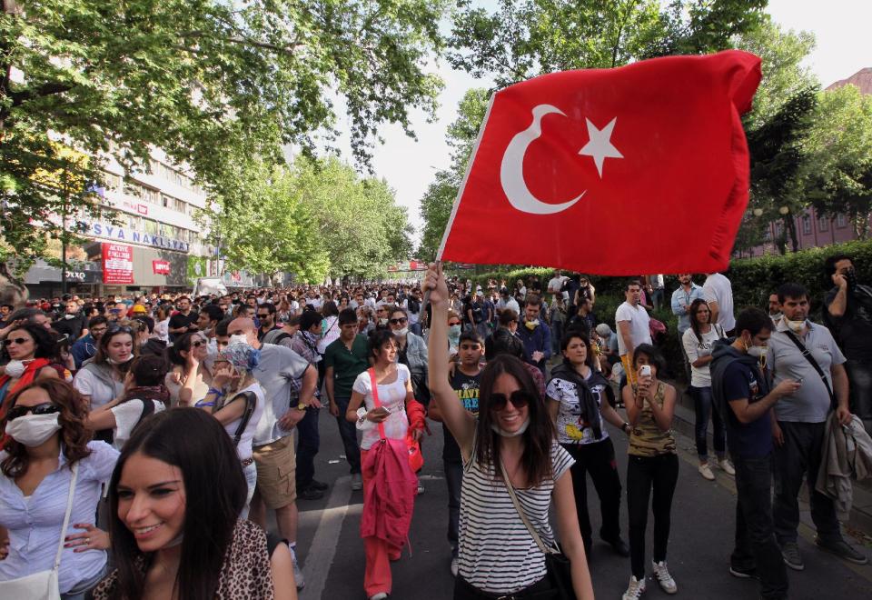 Young Turks walk during a protest in Ankara, Turkey, Sunday, June 2, 2013. Turkey's prime minister Recep Tayyip Erdogan on Sunday rejected claims that he is a "dictator," dismissing protesters as an extremist fringe, even as thousands returned to the landmark Istanbul square that has become the site of the fiercest anti-government outburst in years. (AP Photo/Burhan Ozbilici)