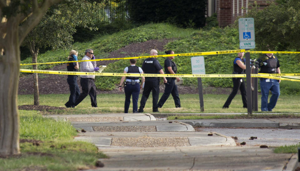 Police work the scene where eleven people were killed during a mass shooting at the Virginia Beach city public works building, May 31, 2019 in Virginia Beach, Va. (Photo: L. Todd Spencer/The Virginian-Pilot via AP)