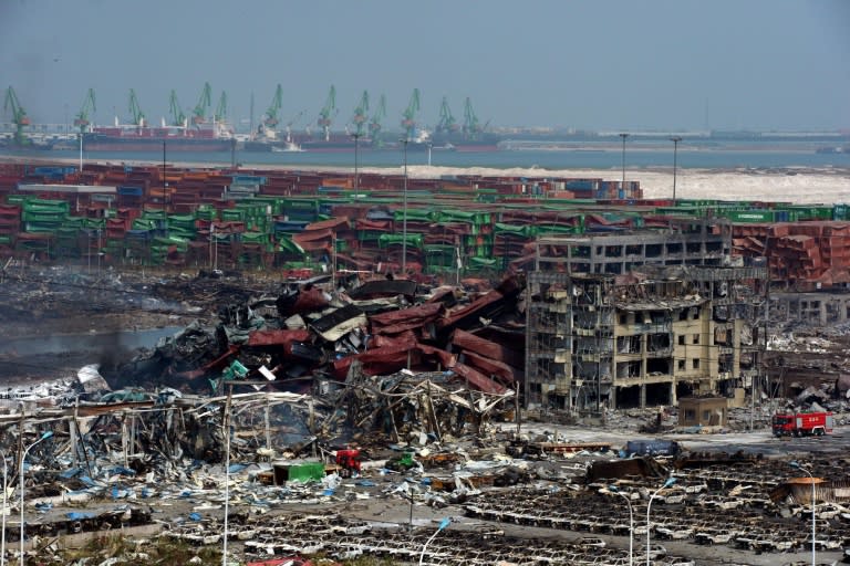 Mangled cargo containers and twisted wreckage in Tianjin pictured on August 16, 2015