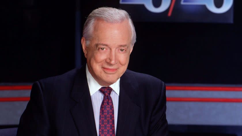 ADVANCE FOR FRIDAY, SEPT. 24––FILE––Hugh Downs is shown on the set of the ABC News magazine "20/20," in this 1993 publicity photo. After tonight's "20/20," Downs will end a 21 year stint as the program's anchor to begin an internet career with iNEXTV, a Web startup covering the government's executive branch. (AP Photo/ABC, Steve Fenn)