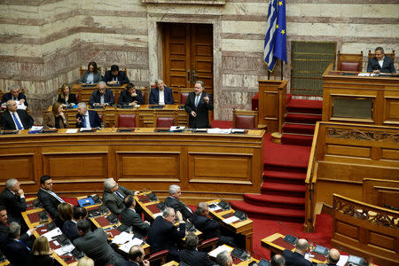 Greek Alternate Minister of Foreign Affairs George Katrougalos addresses lawmakers during a parliamentary session on a name-change agreement with neighbouring Macedonia in Athens, Greece, January 23, 2019. REUTERS/Costas Baltas
