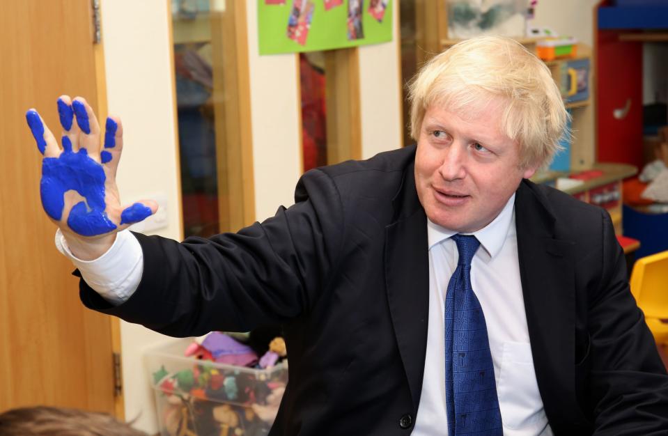 Mayor of London Boris Johnson takes part in a hand painting session during a General Election campaign visit to Advantage Children's Day Nursery in Surbiton, Surrey.